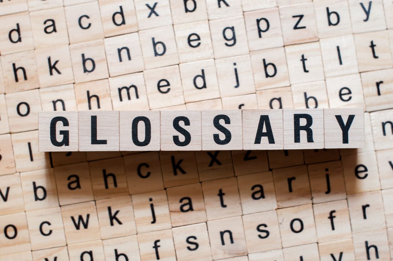 the word glossary spelled out of letter blocks.